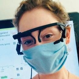 Portrait photo of Katarzyna Wisiecka wearing eye-tracking glasses and a face mask