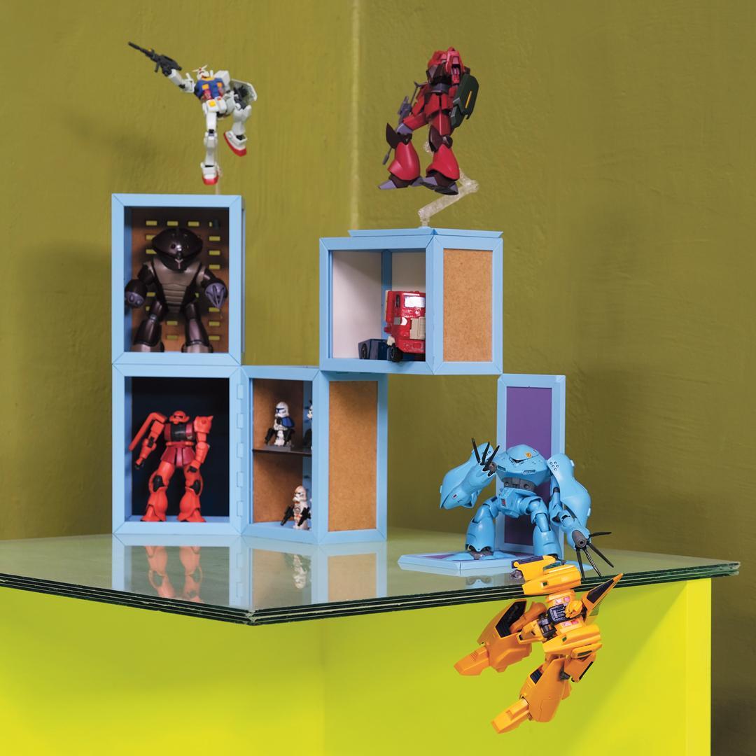 A collection of toy robots in display cases