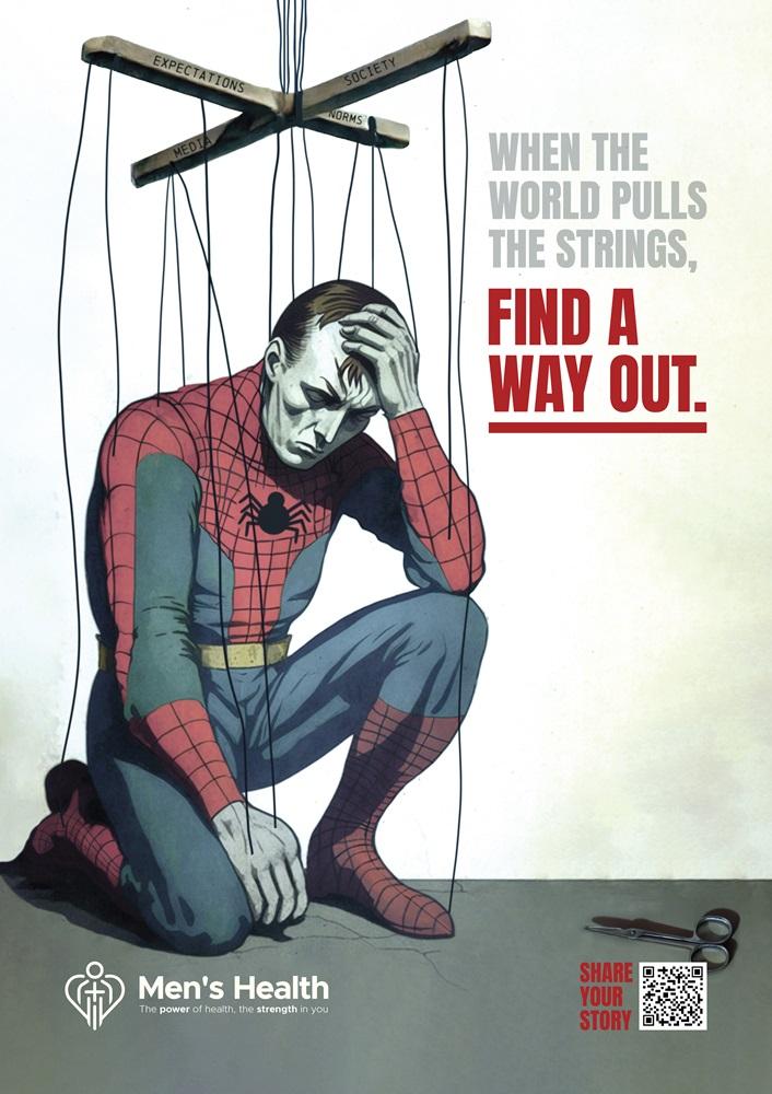 This graphic shows a man dressed as Spiderman, suspended by strings like a puppet. The poster is part of a campaign addressing men’s mental health.