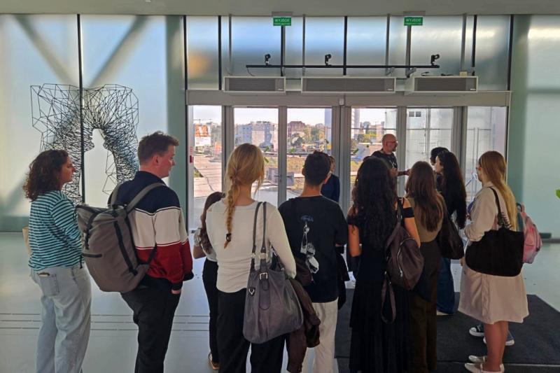 A group of students listen to a guide at Silesian Museum in Katowice