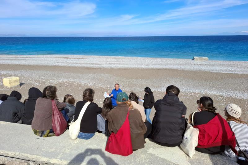 Students from USWPS and UAEGEN attends a seaside lesson to learn about the history of Rhodes, Greece