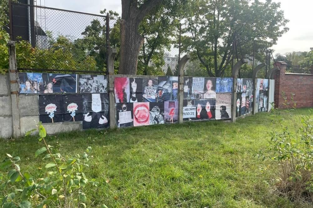 Photos from various protests in Poland displayed on the wall outsied SWPS University in Wrocław