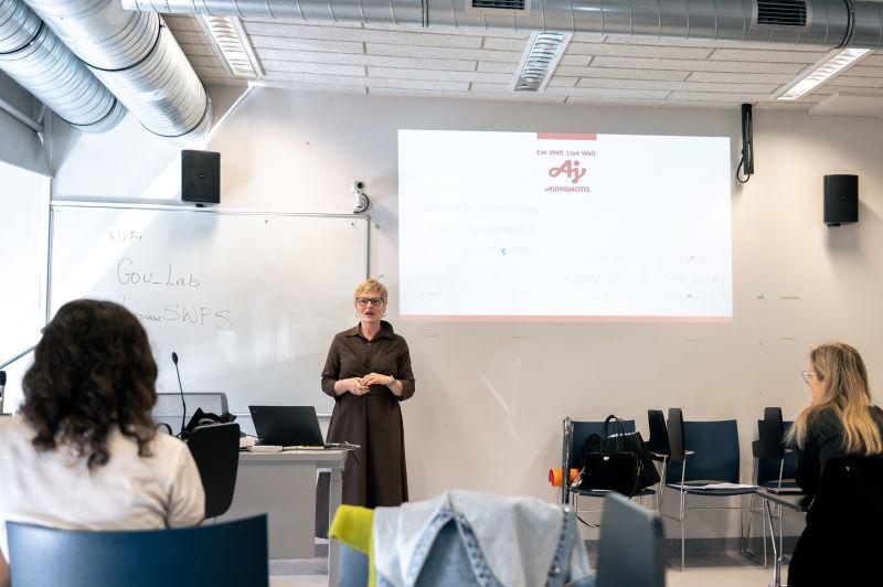 A lecturer giving a presentation in the SWPS University lecture hall