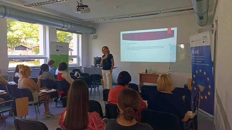 Students listen to lecture by a female professor at USWPS Summer School on the Rule of Law 2024