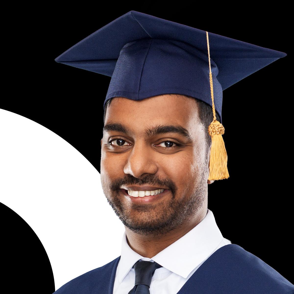 Male student wearing a graduation cap and robe