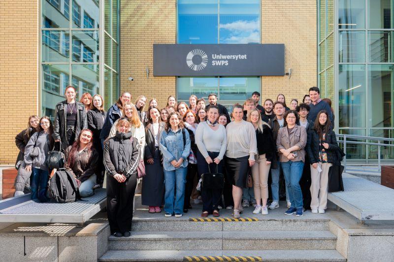 Workshop participants in front of the SWPS University headquarters in Warsaw