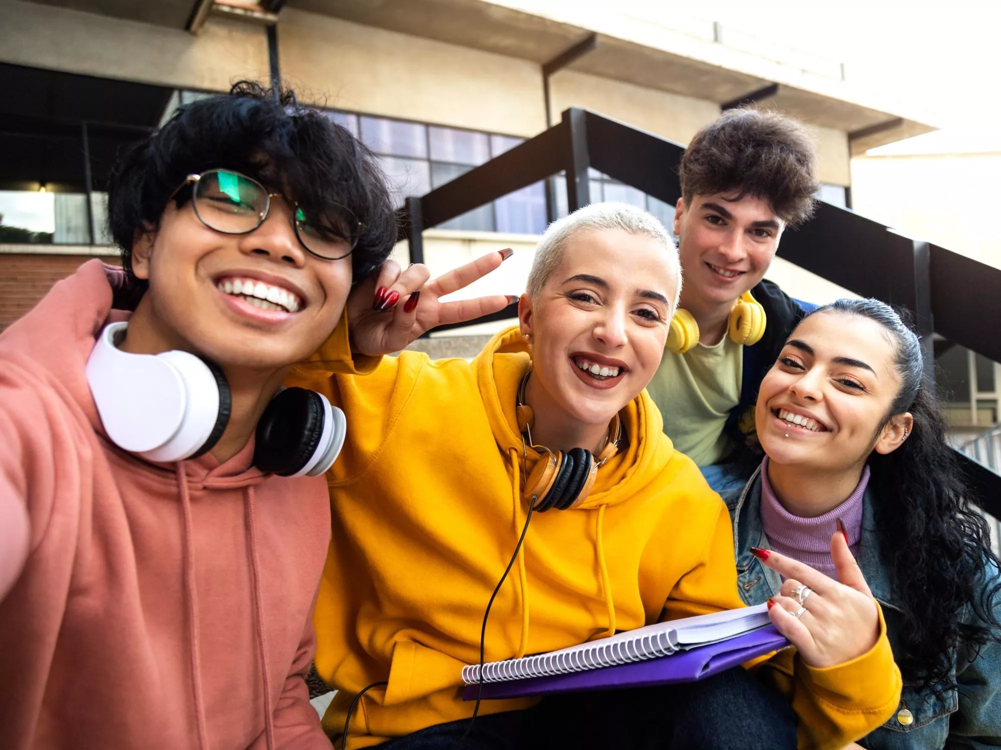 Four young people of diverse ethnicity taking a selfie