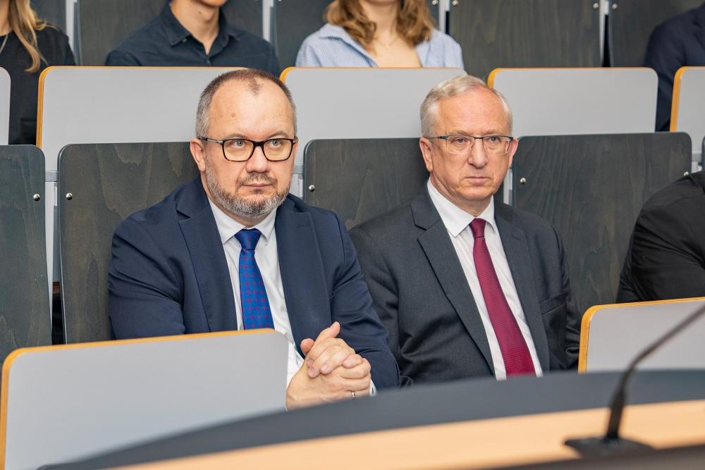 Adam Bodnar and Jan Tombiński sit among the audience