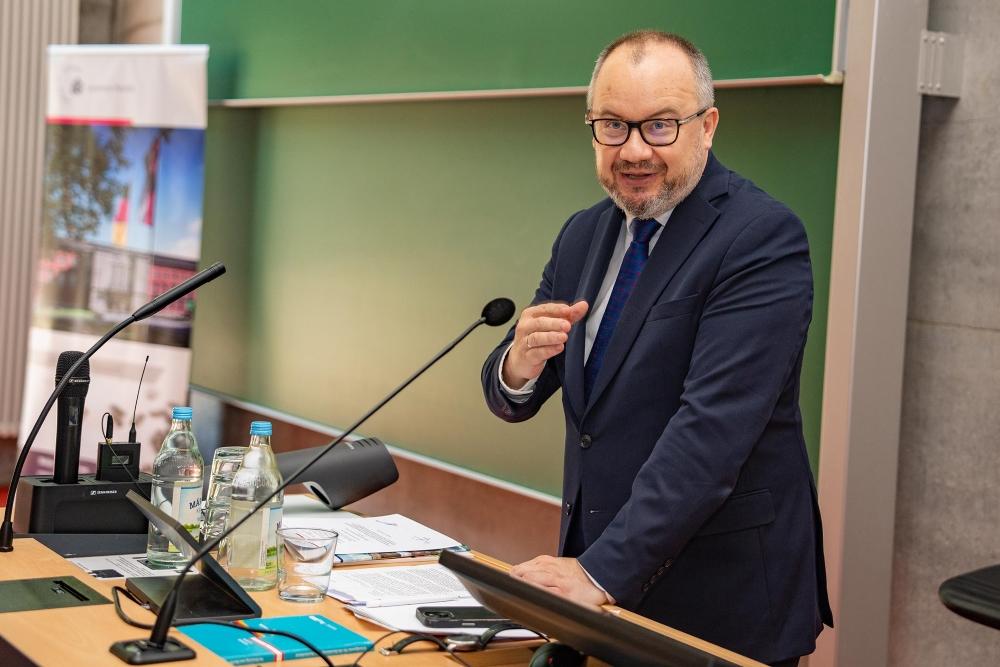 A close-up of Adam Bodnar delivering a lecture