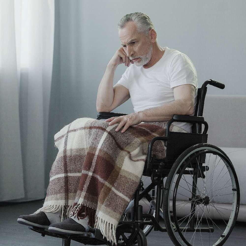 concerned older man in wheelchair