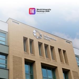 Upper part of the SWPS University building with the ranings logo over it