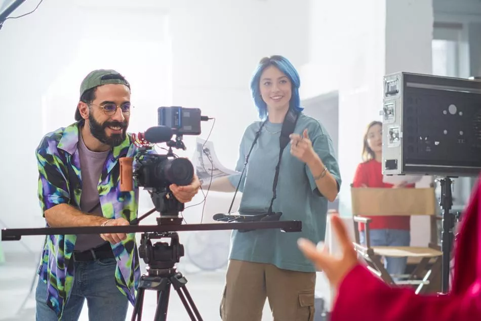 Man and woman filmmakers on a film set