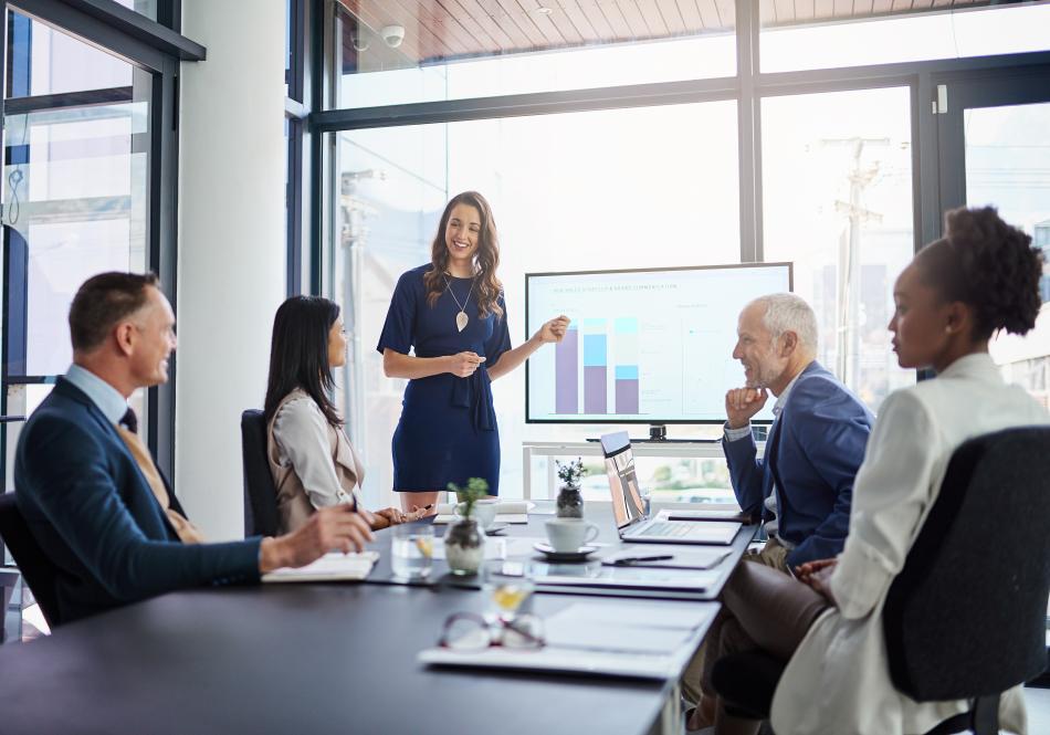 Woman presenting in a business meeting