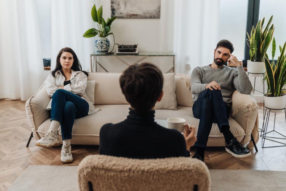 Marriage counsellor conducting a session with a male-female couple