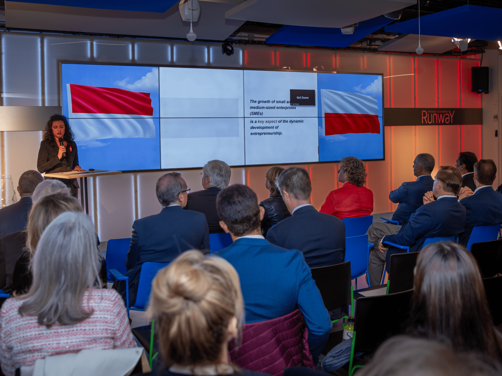 Magdalena Kaczkowska-Serafińska speaking at the conference in Monaco